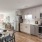 a kitchen with a table and chairs