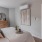 a bedroom with a bed and a mirror