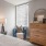 a bedroom with a bed and a chair